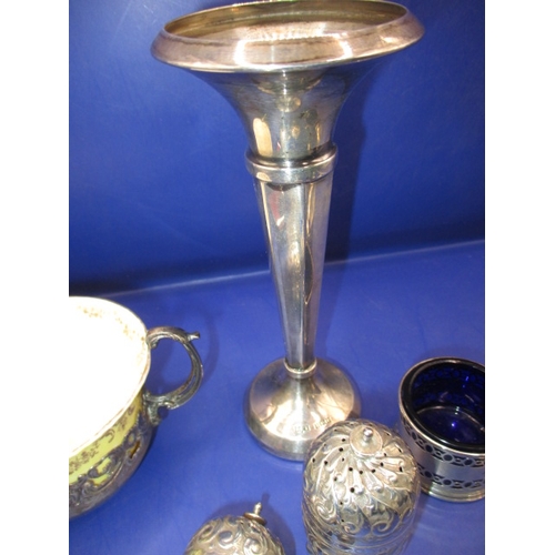 240 - A parcel of silver and white metal fancies, to include cruets cup holder and a ring, all in good pre... 