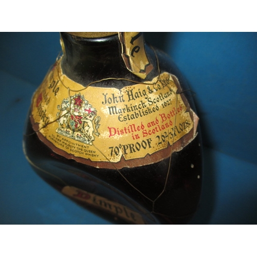 339 - A bottle of 1950s Dimple Scotch whisky, with original mesh outer and labels