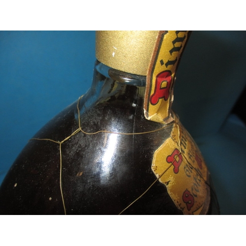 339 - A bottle of 1950s Dimple Scotch whisky, with original mesh outer and labels