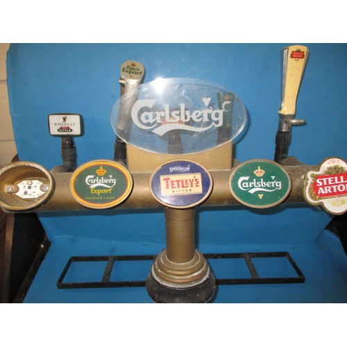 330 - A vintage 5 tap beer pump, being a professional bar model with brass body, in used condition