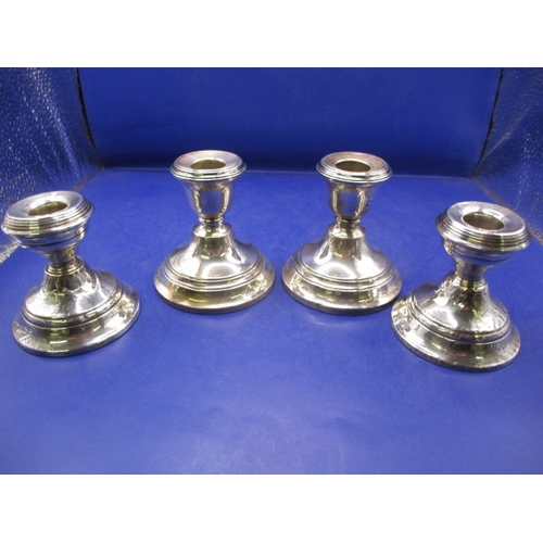 233 - Two pairs of antique sterling silver pygmy candlesticks, one pair with Chester Hallmark, the other L... 