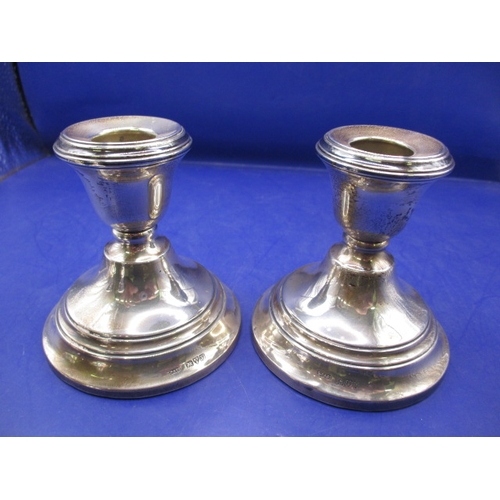 233 - Two pairs of antique sterling silver pygmy candlesticks, one pair with Chester Hallmark, the other L... 