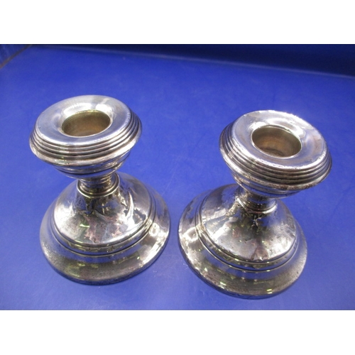 233 - Two pairs of antique sterling silver pygmy candlesticks, one pair with Chester Hallmark, the other L... 