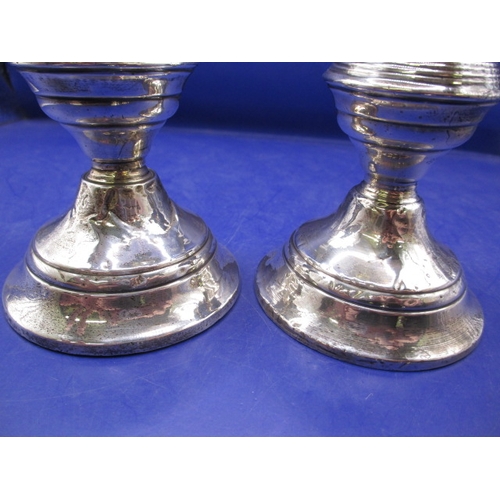 233 - Two pairs of antique sterling silver pygmy candlesticks, one pair with Chester Hallmark, the other L... 