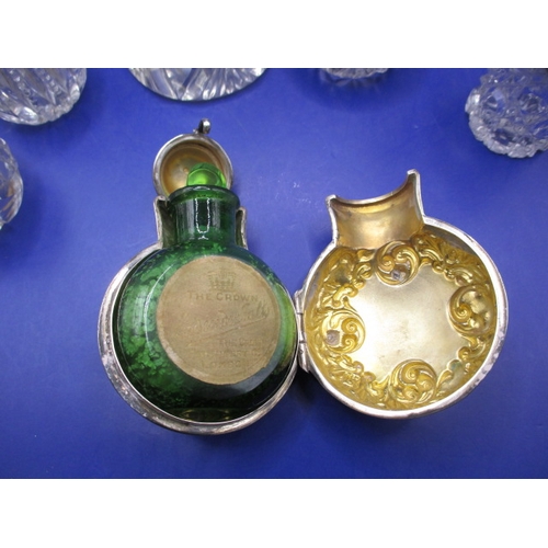 242 - A parcel of silver topped bottles and jars, to include a cased smelling salts bottle, all with gener... 