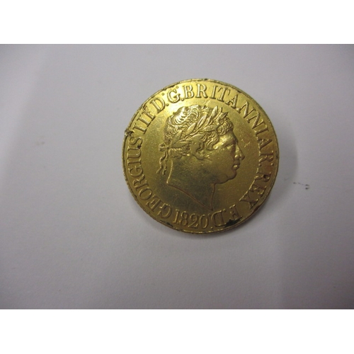 146 - A George III gold sovereign dated 1820, a circulated coin with fine definition of features with mark... 