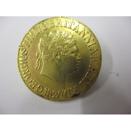 146 - A George III gold sovereign dated 1820, a circulated coin with fine definition of features with mark... 