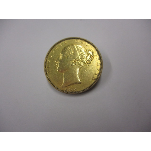 148 - A Victorian gold sovereign dated 1847, a circulated coin with fine definition of features, having th... 