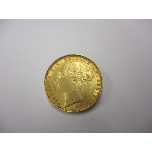 149 - A Victorian gold sovereign dated 1885, a circulated coin with fine definition of features, having ra... 