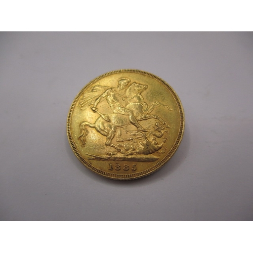 149 - A Victorian gold sovereign dated 1885, a circulated coin with fine definition of features, having ra... 