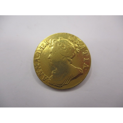 158 - A Queen Anne gold guinea dated 1710, a circulated coin with reasonable definition of features