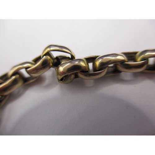 69 - An unmarked yellow gold guard/muff chain, approx. linear length 144cm, approx. weight 55.3g, in usea... 