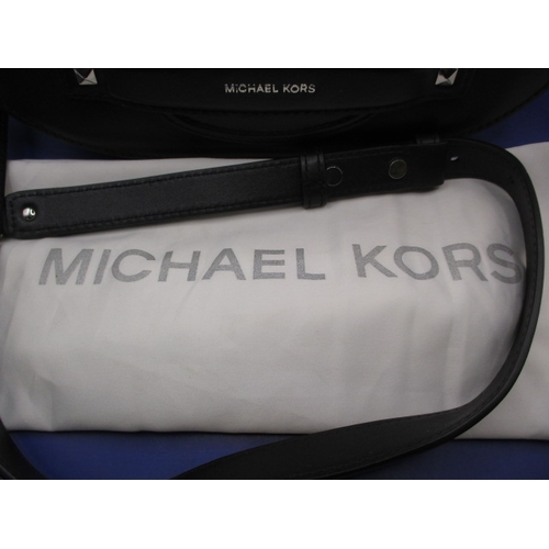 267 - A Michael Kors black evening bag with outer cover bag, in near unused condition