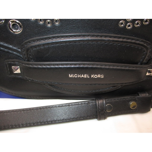 267 - A Michael Kors black evening bag with outer cover bag, in near unused condition