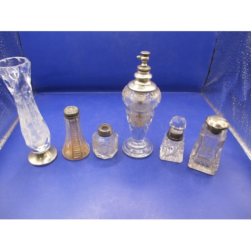 243 - A parcel of vintage scent and other bottles with silver and white metal mounts, all in used conditio... 