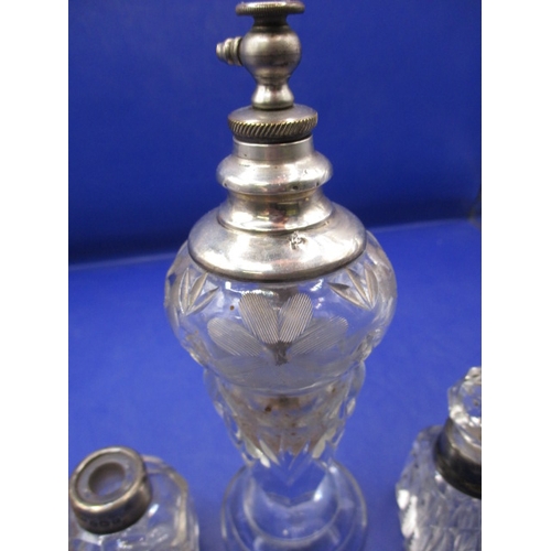 243 - A parcel of vintage scent and other bottles with silver and white metal mounts, all in used conditio... 