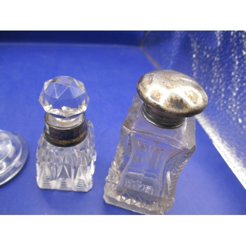 243 - A parcel of vintage scent and other bottles with silver and white metal mounts, all in used conditio... 