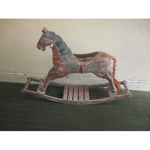 323 - A vintage carved wood rocking horse on bow rocker, in useable pre-owned condition, approx. length 12... 