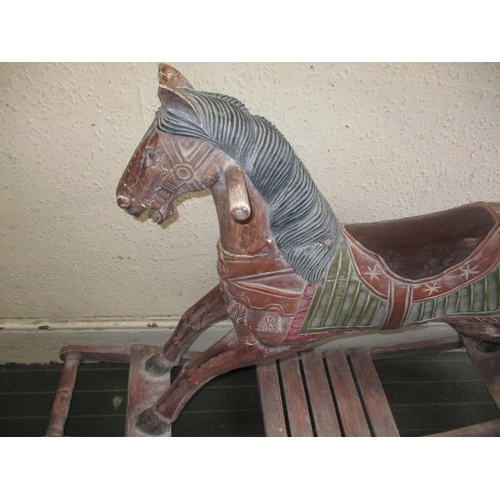 323 - A vintage carved wood rocking horse on bow rocker, in useable pre-owned condition, approx. length 12... 