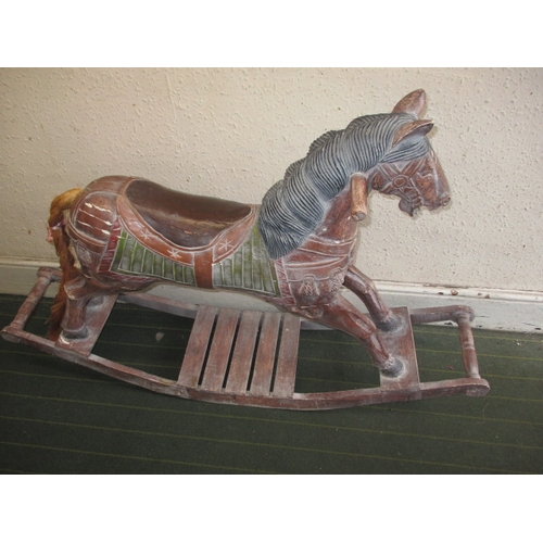 323 - A vintage carved wood rocking horse on bow rocker, in useable pre-owned condition, approx. length 12... 