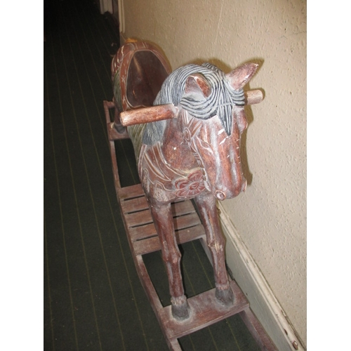 323 - A vintage carved wood rocking horse on bow rocker, in useable pre-owned condition, approx. length 12... 