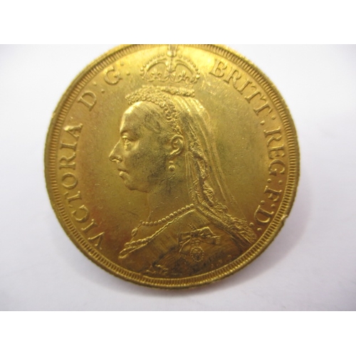 155 - A Victorian gold double sovereign dated 1887, a circulated coin with very fine definition of feature... 