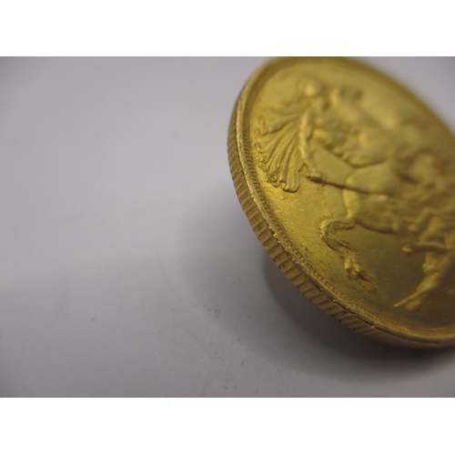 155 - A Victorian gold double sovereign dated 1887, a circulated coin with very fine definition of feature... 