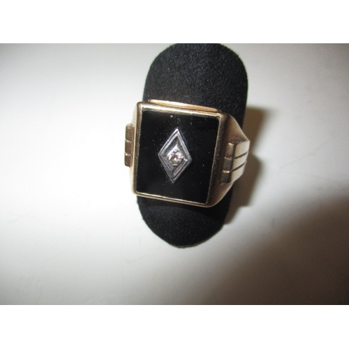 44 - A vintage 10k gold signet ring with central diamond, approx. ring size ‘U’, approx. weight 5.2g in g... 