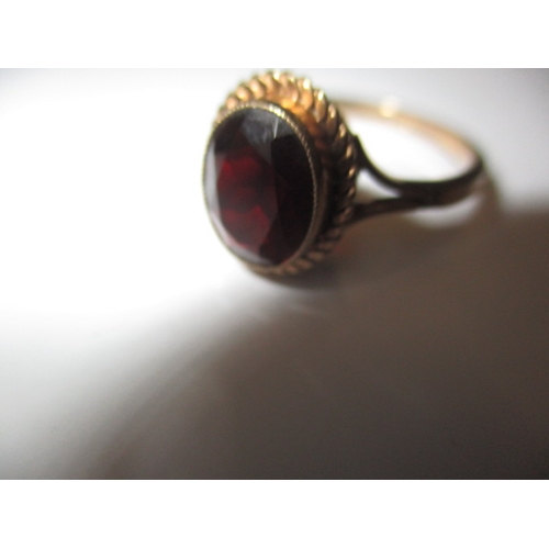 23 - A vintage 9ct gold and garnet dress ring, approx. ring size ‘Q’ approx. weight 2.8g in useable pre-o... 