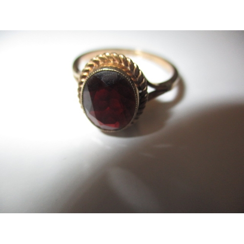 23 - A vintage 9ct gold and garnet dress ring, approx. ring size ‘Q’ approx. weight 2.8g in useable pre-o... 