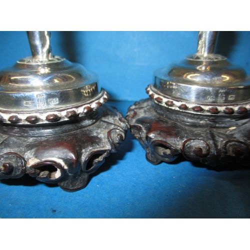 226 - A pair of oriental silver bud vases, with floral decoration, approx. height 15cm having general use-... 