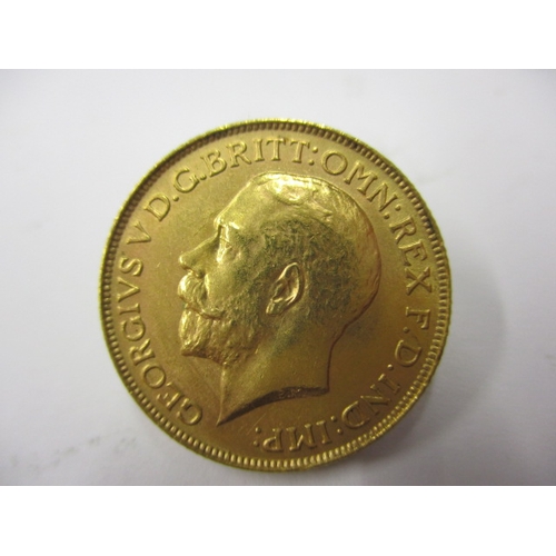 137 - A George V gold sovereign dated 1925, a circulated coin with extra fine definition of features