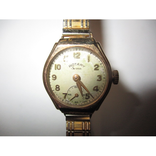 105 - A vintage ladies 9ct gold Rotary Seven wrist watch, with later expanding strap, runs when wound