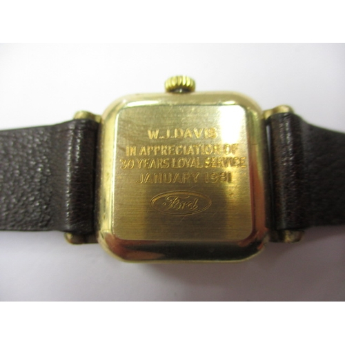 104 - A 1980s Garrards 9ct gold watch in original Garrard & CO box, having dedication on back from Ford mo... 