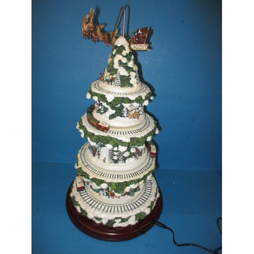 362 - An automaton Christmas decoration of a tree with moving trains, in working pre-owned condition with ... 