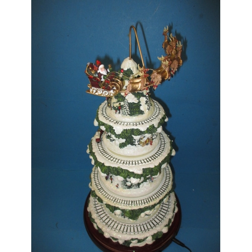 362 - An automaton Christmas decoration of a tree with moving trains, in working pre-owned condition with ... 