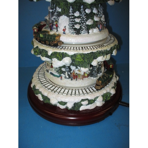 362 - An automaton Christmas decoration of a tree with moving trains, in working pre-owned condition with ... 