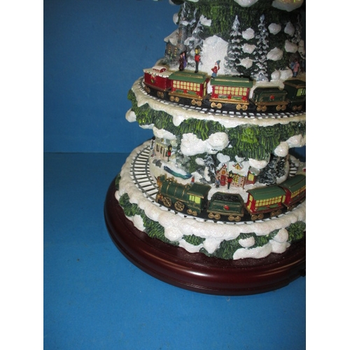 362 - An automaton Christmas decoration of a tree with moving trains, in working pre-owned condition with ... 