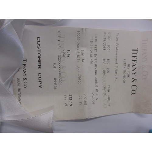 135 - A genuine Tiffany & Co silver interlocking ring set, with original purchase receipt and bag, approx.... 