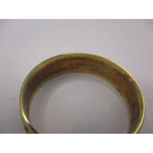 42 - A 750 yellow gold wedding band with geometric pattern, approx. ring size ‘R’ approx. width 5.7mm, ap... 