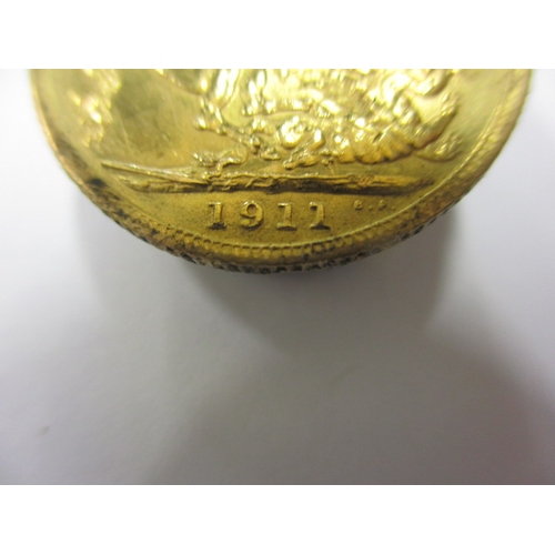 175 - A George V gold sovereign dated 1911, a circulated coin with fine definition of features