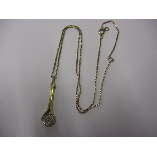 72 - An 18ct gold and diamond necklace pendant in the form of a tennis racquet and a 9ct gold chain, appr... 