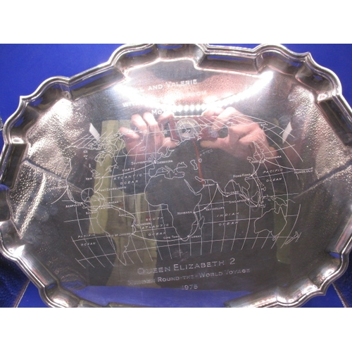 142 - A large sterling silver tray commemorating the maiden round the world voyage of the QEII liner, havi... 