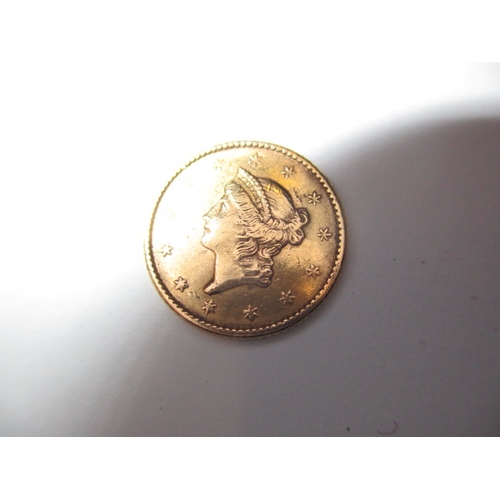 176 - A United States of America gold one dollar coin dated 1852, a circulated coin with fine definition o... 