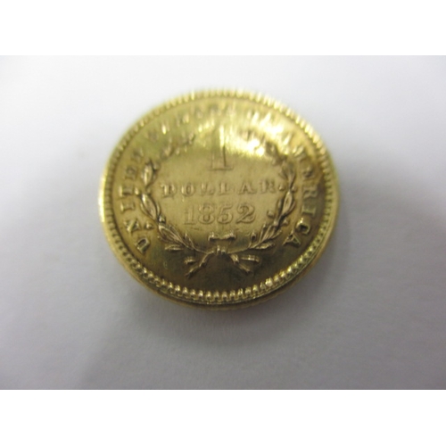 176 - A United States of America gold one dollar coin dated 1852, a circulated coin with fine definition o... 