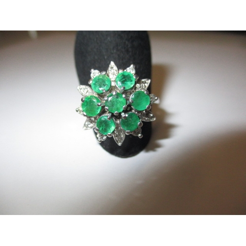 5 - A 750 white gold diamond and emerald cluster ring, approx. ring size ‘Q+’ approx. weight 6g, in good... 