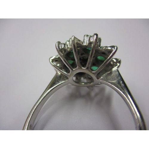 5 - A 750 white gold diamond and emerald cluster ring, approx. ring size ‘Q+’ approx. weight 6g, in good... 