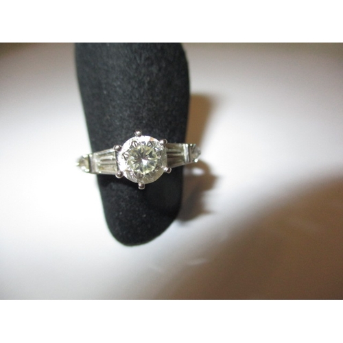 6 - A vintage 585 white gold diamond solitaire ring with diamond set shoulders, approx. ring size ‘O+’, ... 