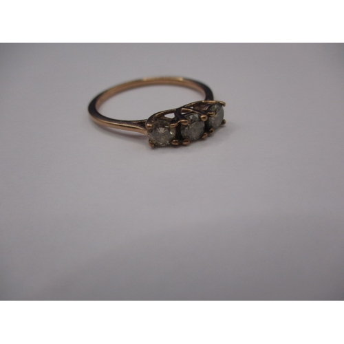 9 - A 9ct yellow gold ring with three champagne diamonds, approx. ring size ‘W’, approx. weight 2.3g in ... 