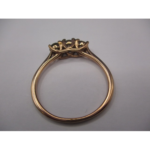 9 - A 9ct yellow gold ring with three champagne diamonds, approx. ring size ‘W’, approx. weight 2.3g in ... 